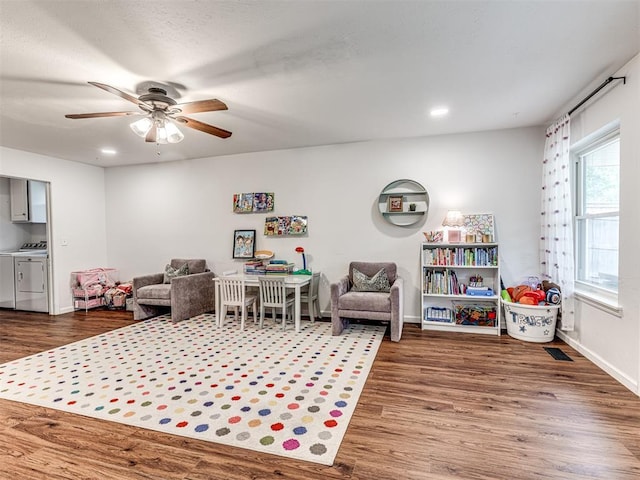 2009 Bella Vista Dr, Edmond, OK 73013 - rec room with washer and clothes dryer, wood finished floors, a ceiling fan, baseboards, and recessed lighting
