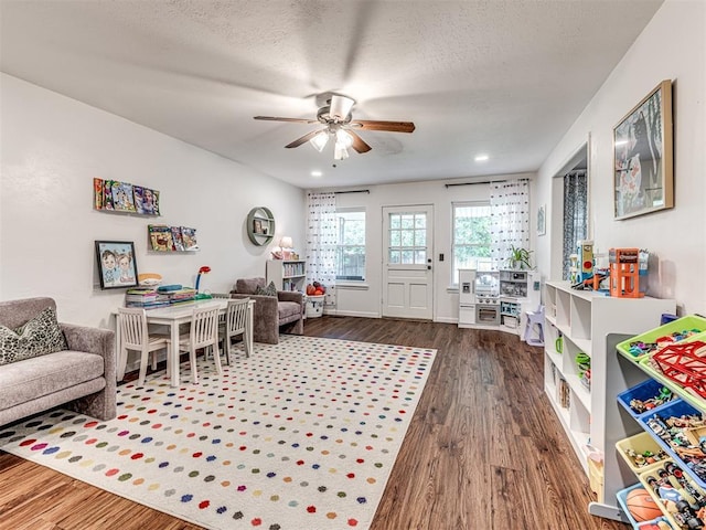 2009 Bella Vista Dr, Edmond, OK 73013 - playroom with ceiling fan, wood finished floors, a textured ceiling, and recessed lighting