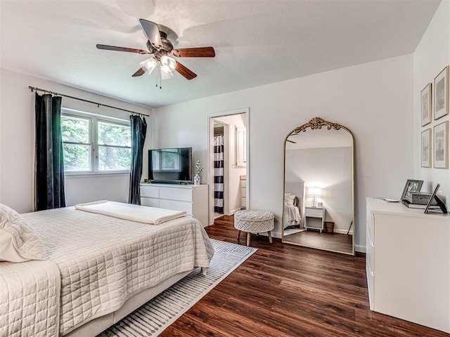 2009 Bella Vista Dr, Edmond, OK 73013 - bedroom with wood finished floors, baseboards, a ceiling fan, and ensuite bathroom