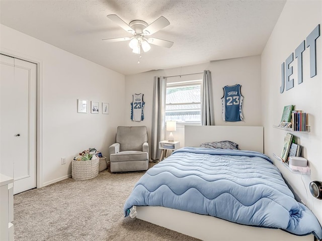 2009 Bella Vista Dr, Edmond, OK 73013 - carpeted bedroom with ceiling fan and a textured ceiling