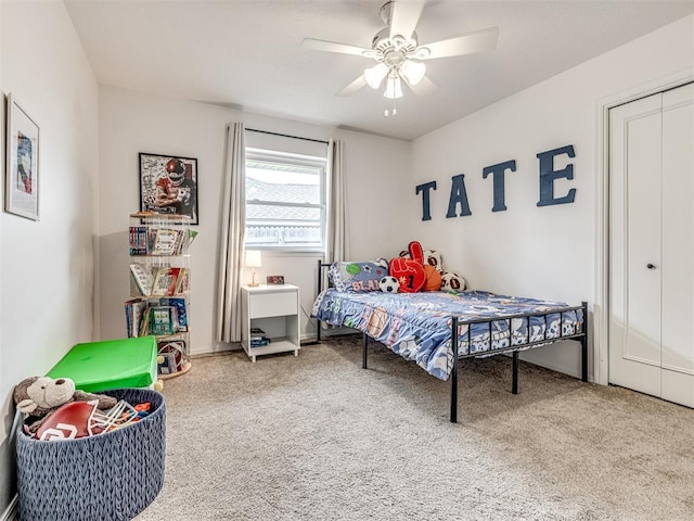 2009 Bella Vista Dr, Edmond, OK 73013 - carpeted bedroom with a ceiling fan and baseboards