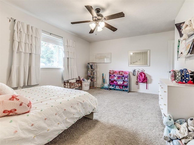 2009 Bella Vista Dr, Edmond, OK 73013 - carpeted bedroom with ceiling fan and baseboards
