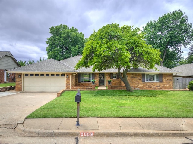 2009 Bella Vista Dr, Edmond, OK 73013 - single story home with an attached garage, driveway, a front lawn, and brick siding