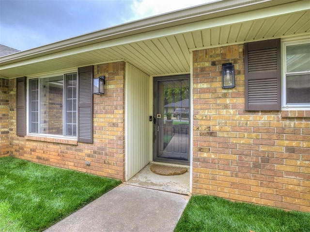 2009 Bella Vista Dr, Edmond, OK 73013 - doorway to property featuring brick siding