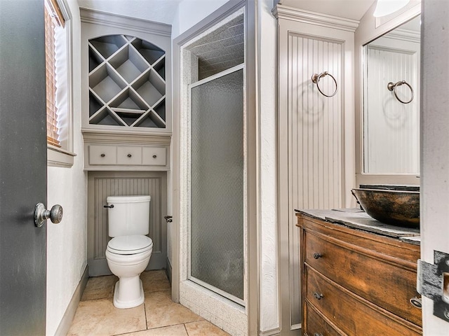 212 W Ridgewood Dr, Midwest City, OK 73130 - bathroom featuring vanity, a stall shower, toilet, tile patterned flooring, and baseboards