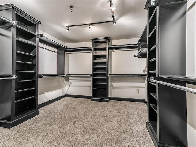 212 W Ridgewood Dr, Midwest City, OK 73130 - walk in closet with carpet flooring