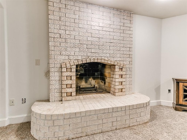212 W Ridgewood Dr, Midwest City, OK 73130 - detailed view of carpet floors, baseboards, and a fireplace
