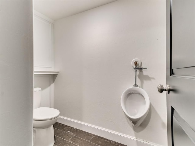 212 W Ridgewood Dr, Midwest City, OK 73130 - bathroom with toilet, baseboards, and tile patterned floors