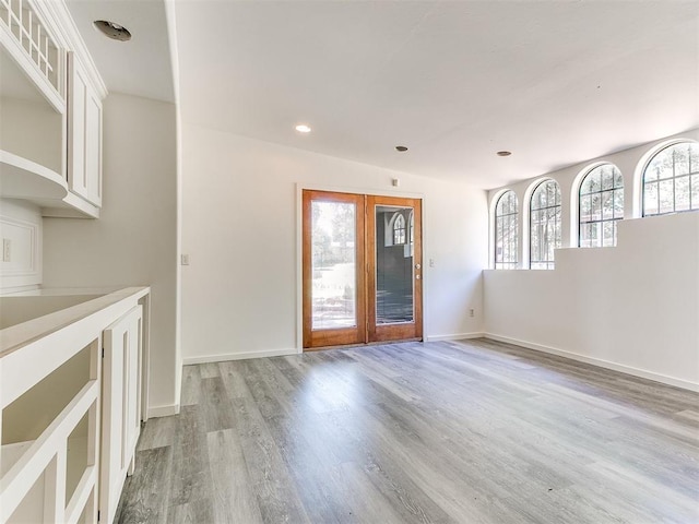 212 W Ridgewood Dr, Midwest City, OK 73130 - unfurnished dining area with light wood-style floors, baseboards, and recessed lighting