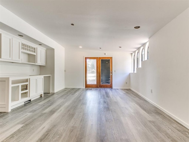 212 W Ridgewood Dr, Midwest City, OK 73130 - unfurnished living room featuring light wood-style floors, baseboards, and recessed lighting