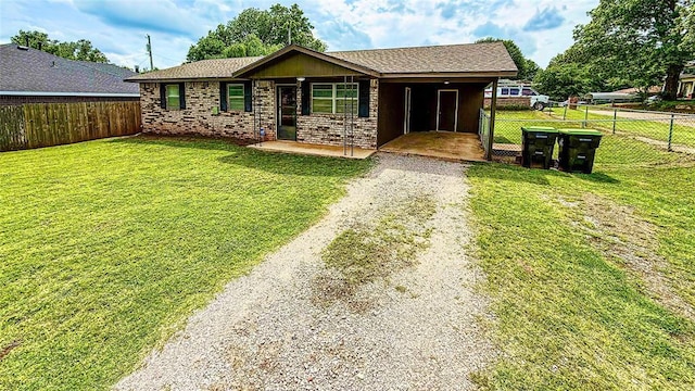703 S 2nd Ave, Purcell, OK 73080 - ranch-style home featuring driveway and a carport