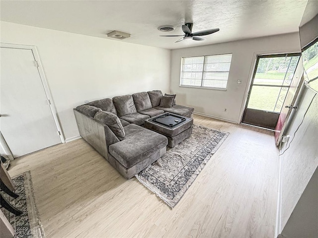 703 S 2nd Ave, Purcell, OK 73080 - living area with light wood-style floors, ceiling fan, and baseboards
