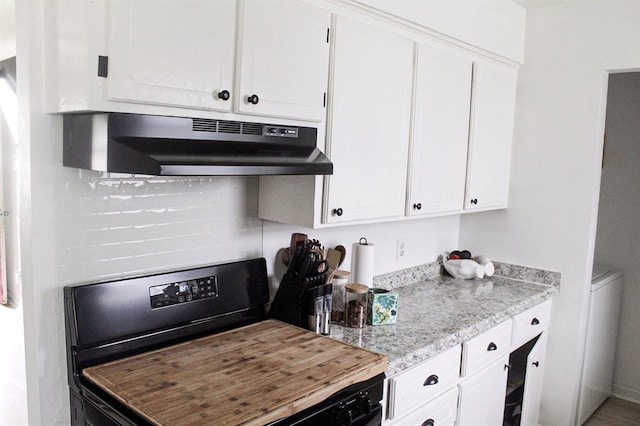 703 S 2nd Ave, Purcell, OK 73080 - kitchen with under cabinet range hood, stainless steel stove, white cabinetry, and decorative backsplash