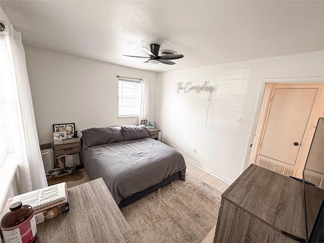 703 S 2nd Ave, Purcell, OK 73080 - bedroom featuring a ceiling fan and wood finished floors