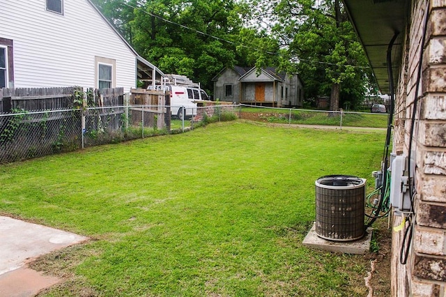 703 S 2nd Ave, Purcell, OK 73080 - view of yard featuring central air condition unit