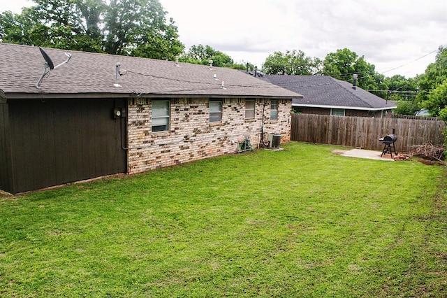 703 S 2nd Ave, Purcell, OK 73080 - view of yard featuring a patio and central AC unit