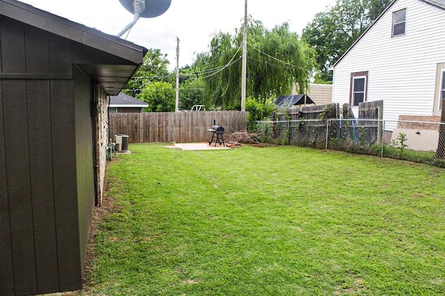 703 S 2nd Ave, Purcell, OK 73080 - view of yard featuring cooling unit and a patio