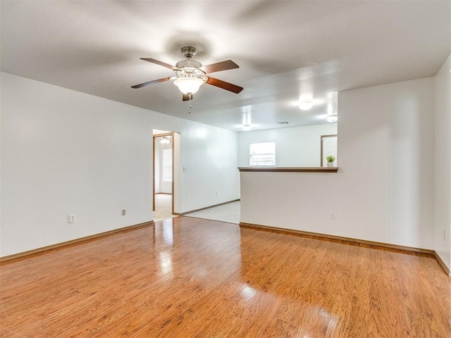 4537 SE 80th St, Del City, OK 73135 - spare room featuring a ceiling fan, light wood-style flooring, and baseboards
