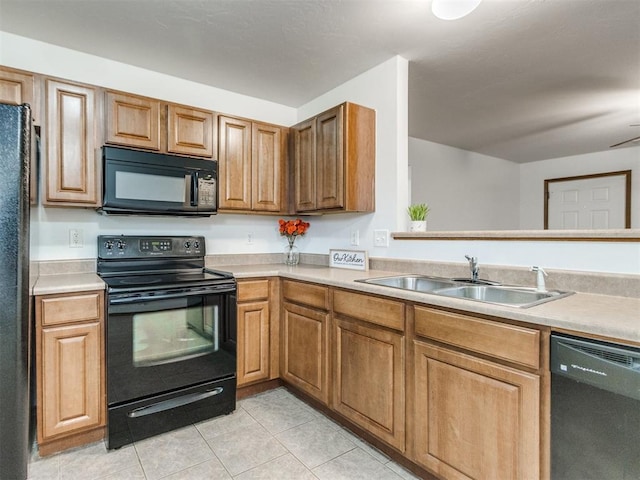4537 SE 80th St, Del City, OK 73135 - kitchen featuring black appliances, a sink, light tile patterned flooring, and light countertops