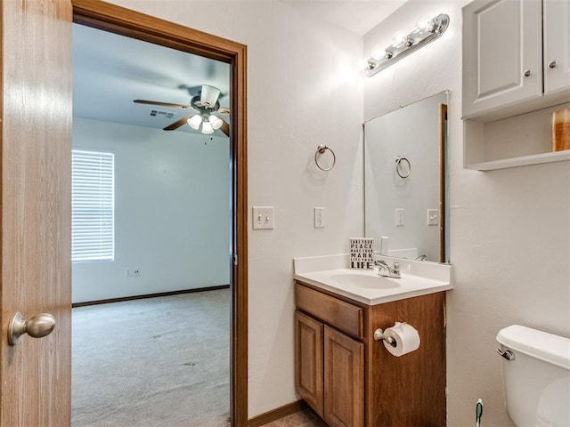 4537 SE 80th St, Del City, OK 73135 - bathroom featuring vanity, ceiling fan, toilet, and baseboards