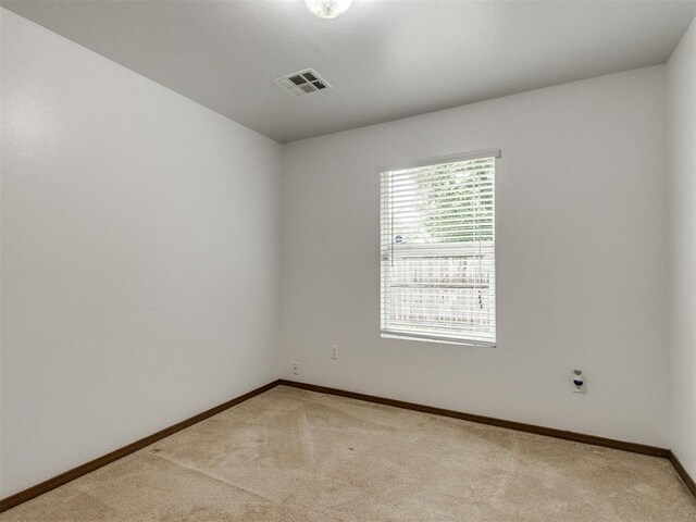 4537 SE 80th St, Del City, OK 73135 - spare room featuring light colored carpet and baseboards