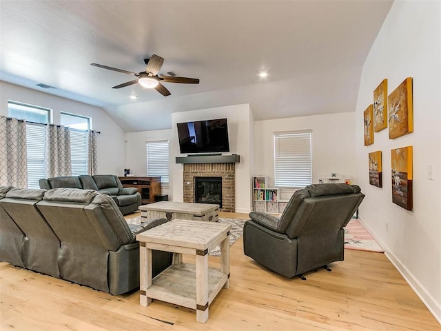 16125 Buffalo Dr, Moore, OK 73170 - living area with vaulted ceiling, ceiling fan, light wood finished floors, a fireplace, and baseboards