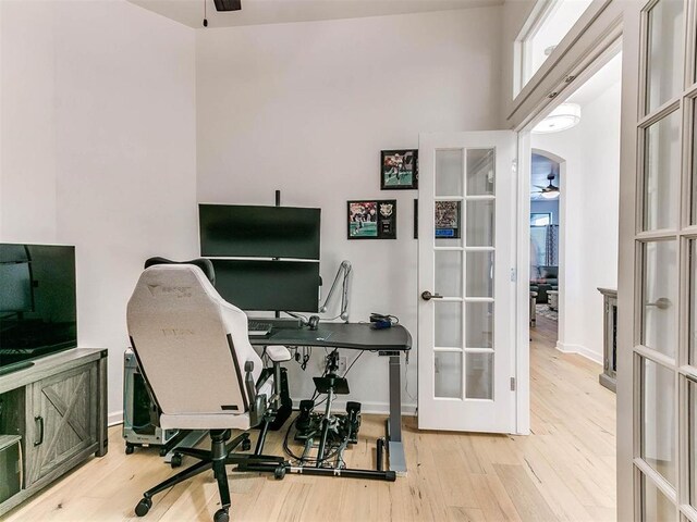 16125 Buffalo Dr, Moore, OK 73170 - home office with a ceiling fan, french doors, and wood finished floors