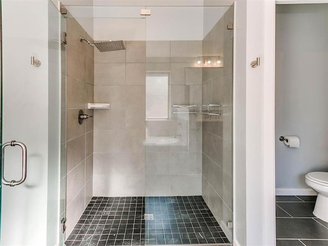 16125 Buffalo Dr, Moore, OK 73170 - bathroom with a stall shower, toilet, and tile patterned floors