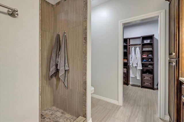 7224 NW 146th St, Oklahoma City, OK 73142 - full bath with a shower stall, toilet, a spacious closet, and baseboards