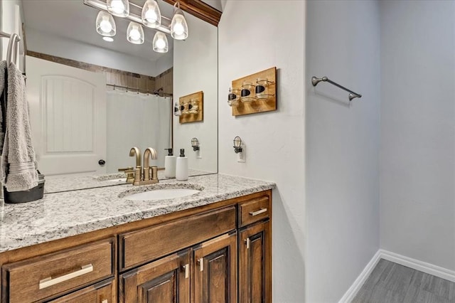 7224 NW 146th St, Oklahoma City, OK 73142 - bathroom with vanity, wood finished floors, baseboards, and a shower with curtain