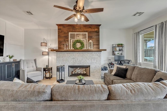 7224 NW 146th St, Oklahoma City, OK 73142 - living area with ceiling fan and a fireplace
