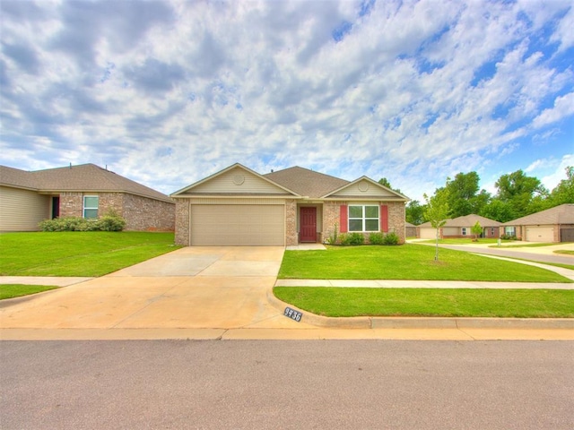 9436 SW 37th St, Oklahoma City, OK 73179 - ranch-style house with an attached garage, concrete driveway, a front lawn, and brick siding