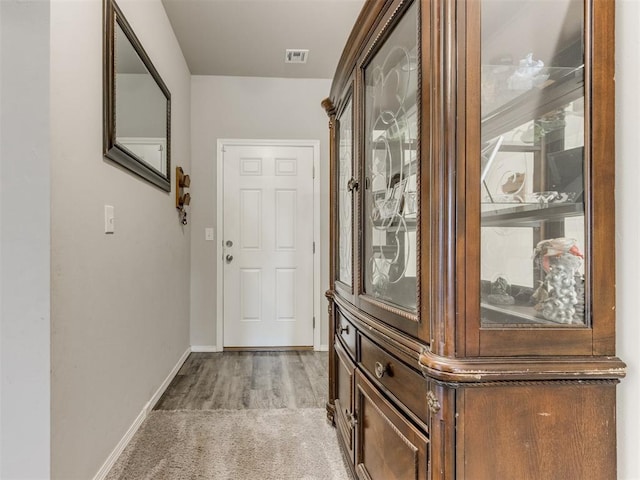 9436 SW 37th St, Oklahoma City, OK 73179 - doorway to outside featuring baseboards and light wood-type flooring