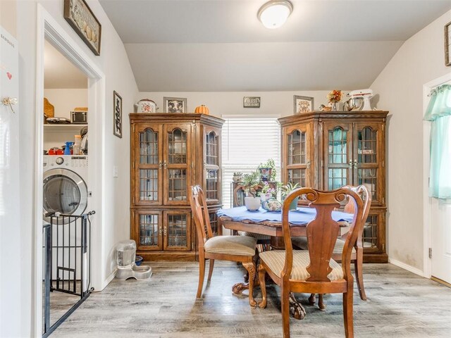 9436 SW 37th St, Oklahoma City, OK 73179 - dining space featuring light wood finished floors, lofted ceiling, and baseboards