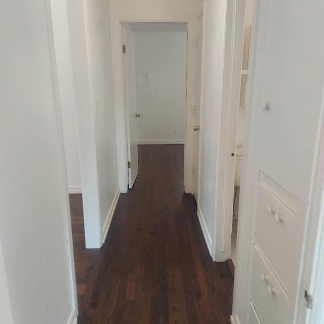 7123 NW 44th St, Bethany, OK 73008 - corridor with wood finished floors and baseboards