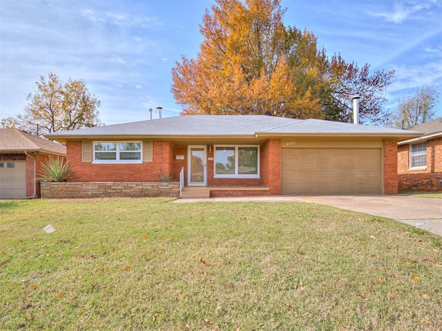 4809 N Pate Ave, Oklahoma City, OK 73112 - ranch-style house featuring a garage, driveway, a front lawn, and brick siding