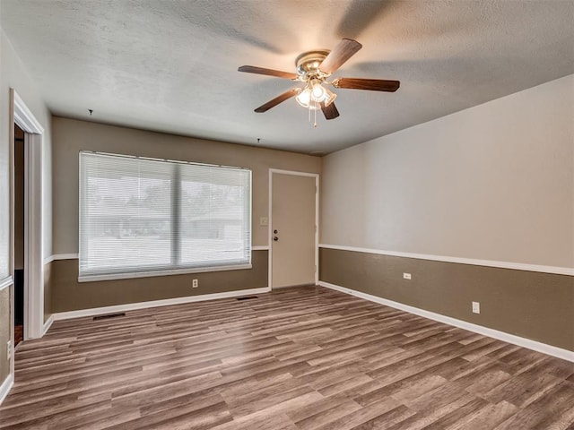 4809 N Pate Ave, Oklahoma City, OK 73112 - unfurnished room featuring wood finished floors, ceiling fan, a textured ceiling, and baseboards