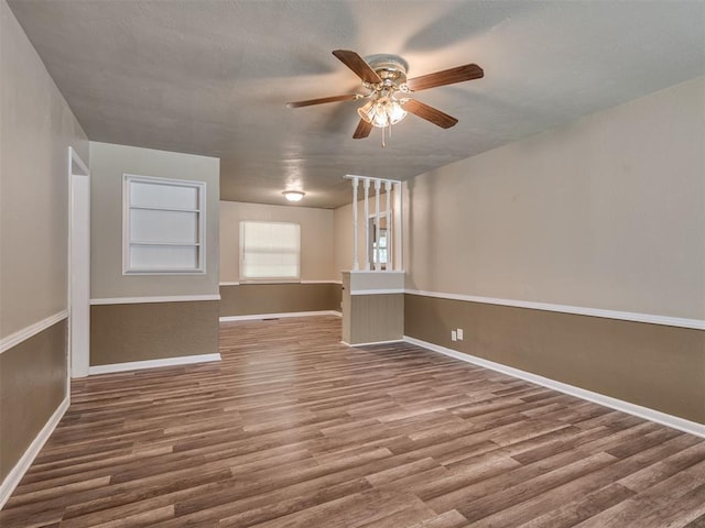 4809 N Pate Ave, Oklahoma City, OK 73112 - spare room with wood finished floors, ceiling fan, and baseboards