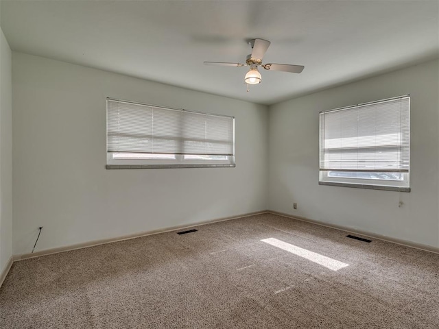 4809 N Pate Ave, Oklahoma City, OK 73112 - spare room featuring healthy amount of natural light, carpet, ceiling fan, and baseboards
