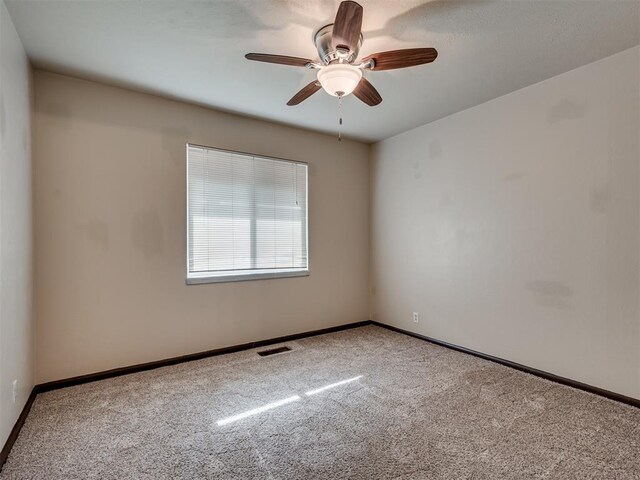 4809 N Pate Ave, Oklahoma City, OK 73112 - unfurnished room with carpet floors, baseboards, and ceiling fan