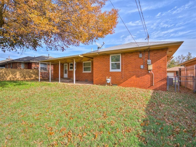 4809 N Pate Ave, Oklahoma City, OK 73112 - back of property featuring brick siding and a patio area