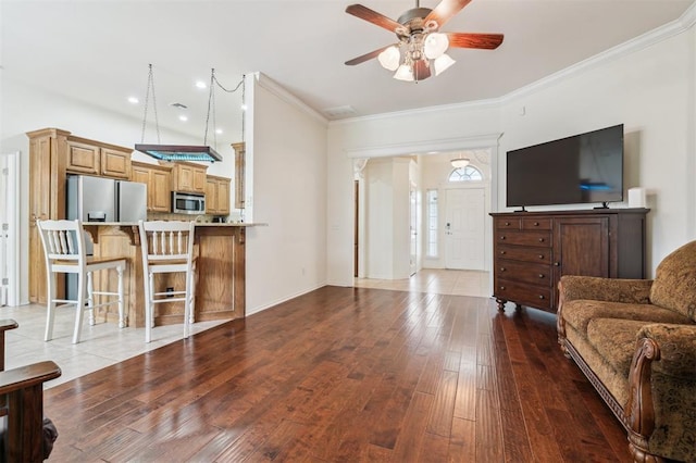 2632 SE 97th St, Moore, OK 73160 - living area featuring a ceiling fan, crown molding, hardwood / wood-style floors, and baseboards