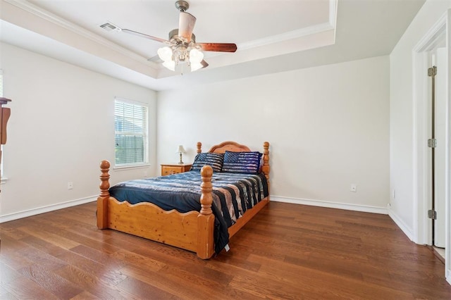2632 SE 97th St, Moore, OK 73160 - bedroom featuring a raised ceiling, wood finished floors, ornamental molding, a ceiling fan, and baseboards