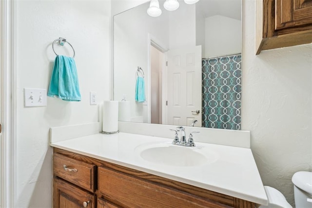 2632 SE 97th St, Moore, OK 73160 - full bathroom with toilet, vanity, and a textured wall