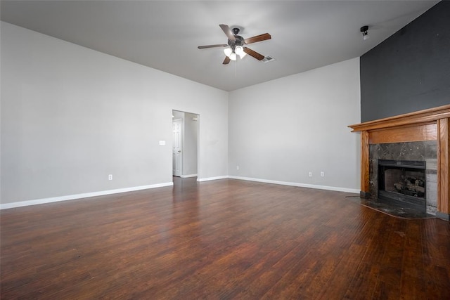 1704 Sumac Dr, Norman, OK 73071 - unfurnished living room featuring a ceiling fan, dark wood finished floors, a fireplace, and baseboards