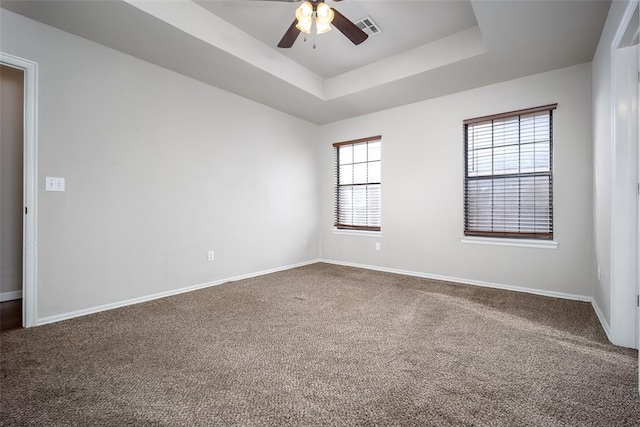 1704 Sumac Dr, Norman, OK 73071 - spare room with ceiling fan, carpet floors, a tray ceiling, and baseboards