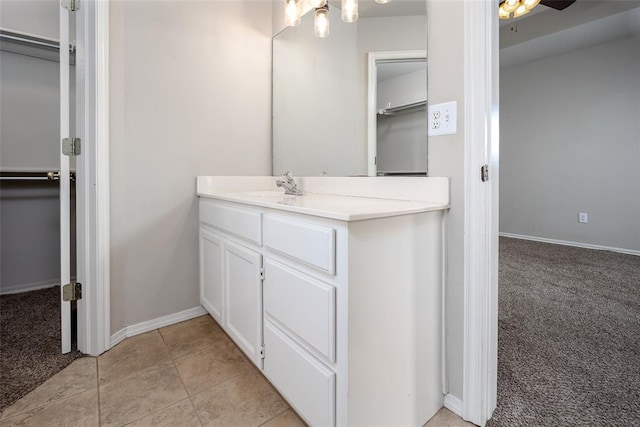 1704 Sumac Dr, Norman, OK 73071 - bathroom with vanity, baseboards, and a ceiling fan