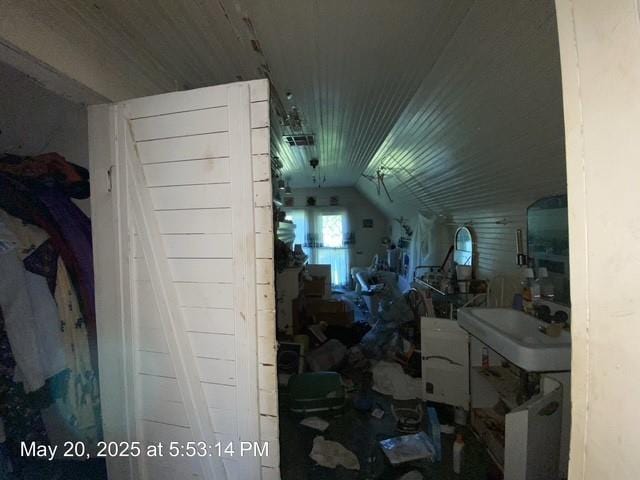 820 NW E St, Ardmore, OK 73401 - bathroom with vaulted ceiling and a sink