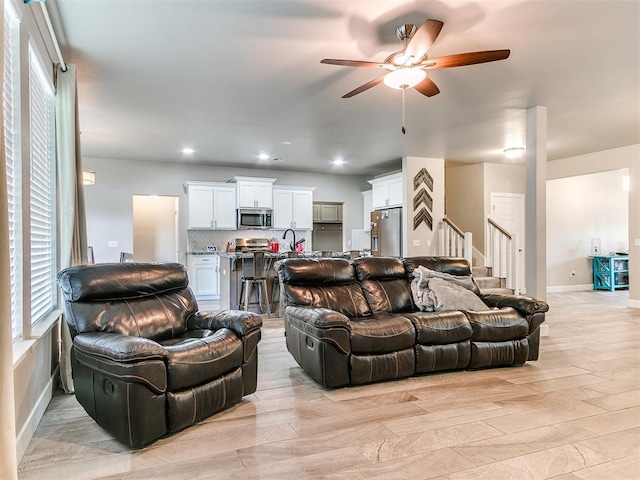 1405 Atalon Dr, Moore, OK 73160 - living area featuring a ceiling fan, stairs, and recessed lighting