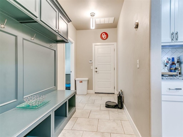 1405 Atalon Dr, Moore, OK 73160 - mudroom with light tile patterned floors and baseboards